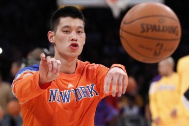 Newly acquired New York Knicks guard Jeremy Lin passes the ball during warm-ups before the NBA basketball game against the Los Angeles Lakers in Los Angeles