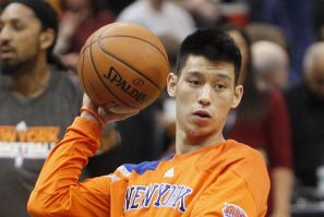 New York Knicks guard Jeremy Lin shoots baskets during warm-up before the start of game against Timberwolves in Minneapolis