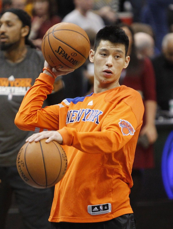 New York Knicks guard Jeremy Lin shoots baskets during warm-up before the start of game against Timberwolves in Minneapolis