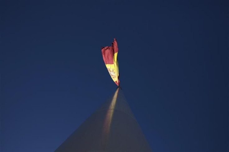 The Spanish flag flutters over the Colon square in central Madrid