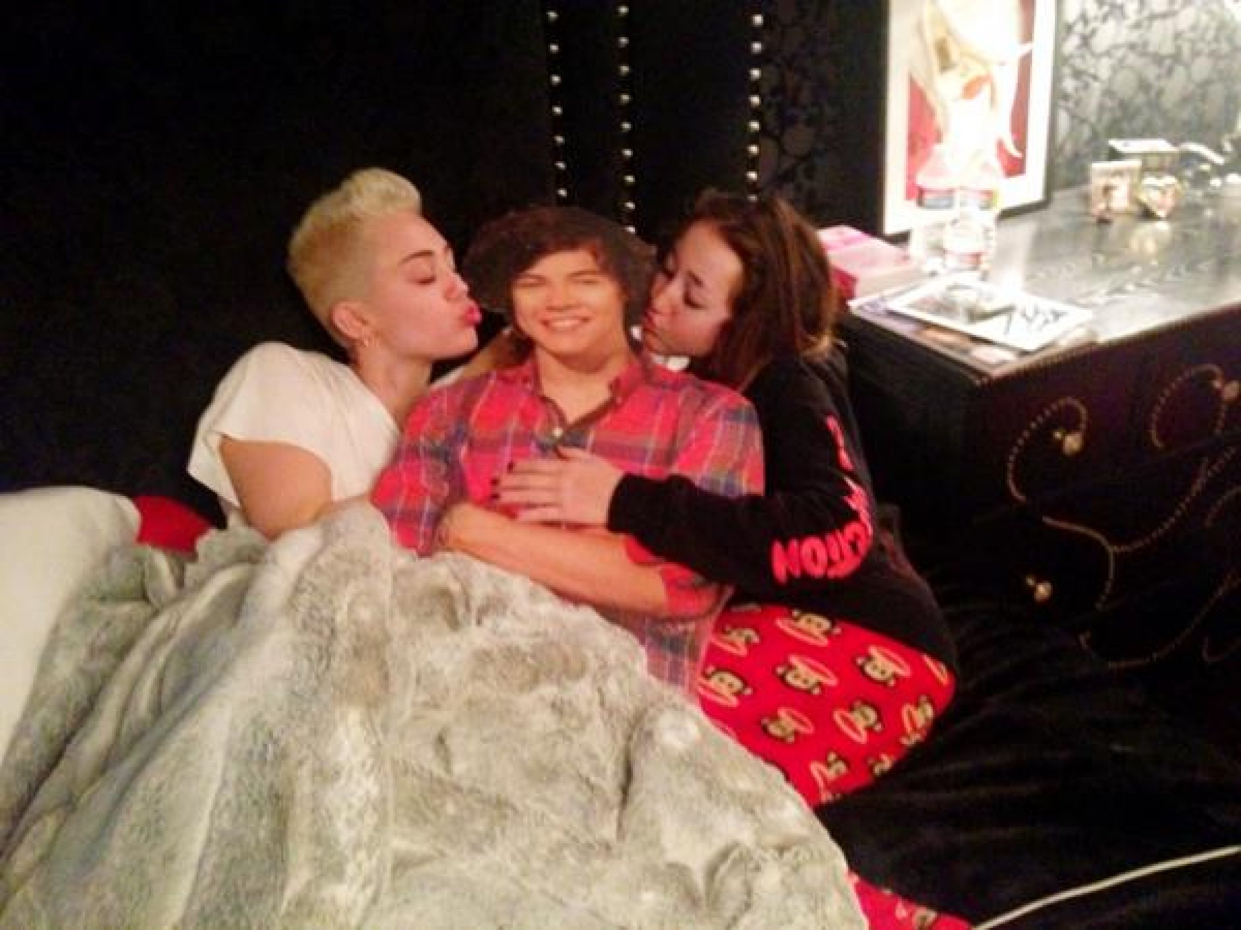 Miley Cyrus Takes Photos In Bed With Harry Styles Of One Direction