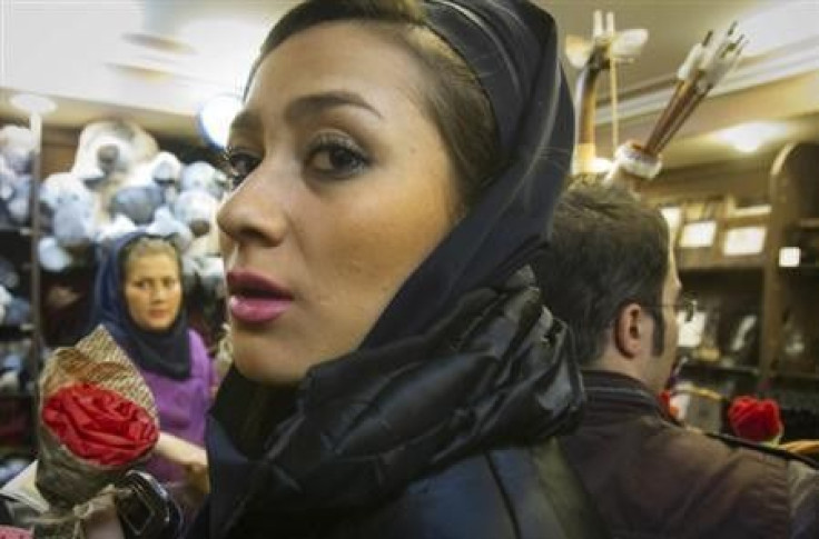 An Iranian woman buys a gift during Valentine&#039;s day shopping at a shop in Tehran