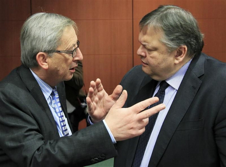 Luxembourg's Prime Minister and Eurogroup chairman Juncker talks with Greece's Finance Minister Evangelos Venizelos at the start of a Eurogroup meeting in Brussels