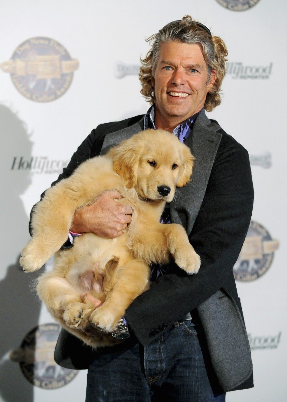 Director Robert Vince along with B-Dawg arrive at the first annual Golden Collar Awards celebrating Hollywoods most talented canine thespians from Oscar nominated films and Emmy Award winning television shows in Los Angeles, California 