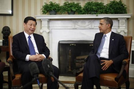 U.S. President Barack Obama listens to China's Vice President Xi Jinping during their meeting in Washington