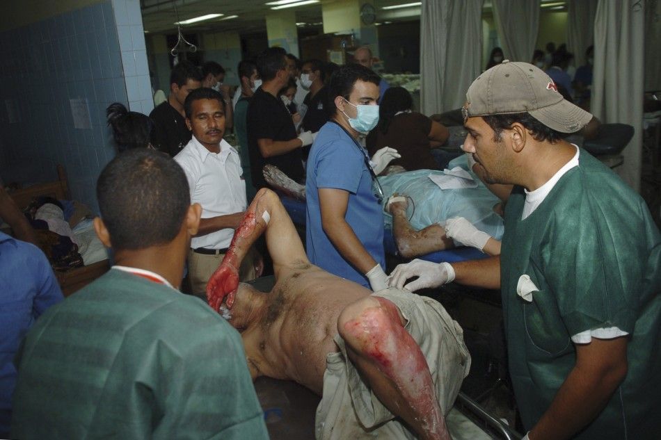 An injured man lies on a stretcher at Escuela hospital in the capital Tegucigalpa