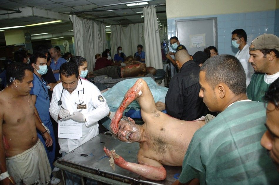 An injured man is attended to at Escuela hospital in the capital Tegucigalpa