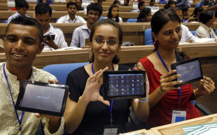 Indian students show off their tablet computers