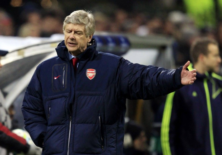 Arsenal's manager Arsène Wenger reacts during their Champions League round of 16 soccer match against Milan at the San Siro, February 15, 2012.