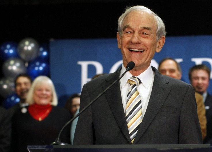 Republican presidential candidate Ron Paul smiles while speaking to supporters at his Maine caucus night rally in Portland