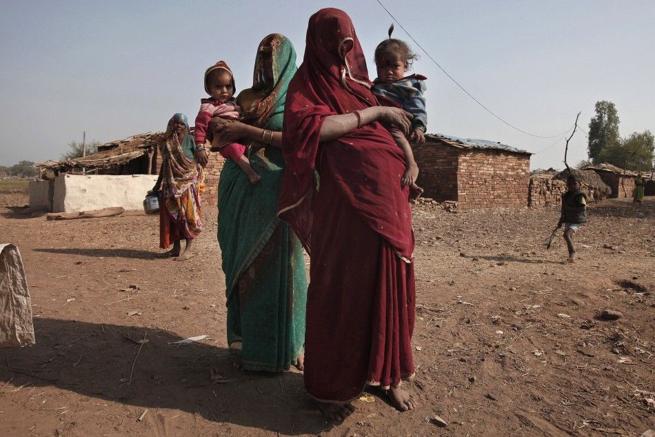 Women of the Sahariya tribe in northwestern India bring their malnourished children to a local clinic