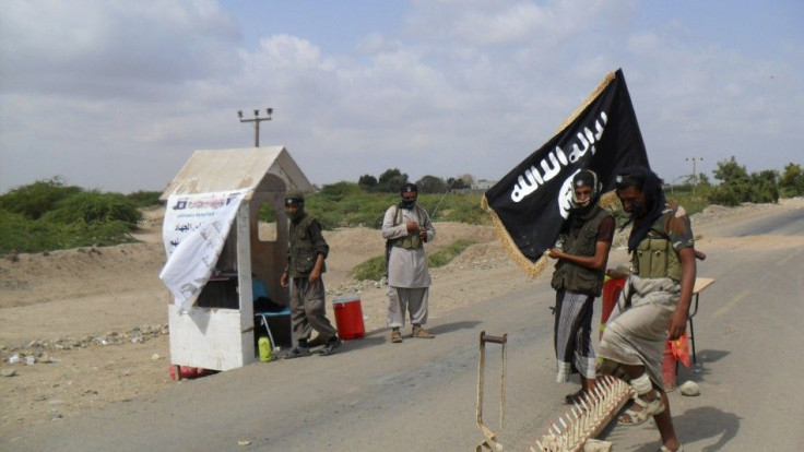 Al Qaeda militants man a checkpoint at the entrance of the southern Yemeni city of Zinjibar