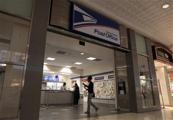 A woman walks into a post office which is due to close in Los Angeles