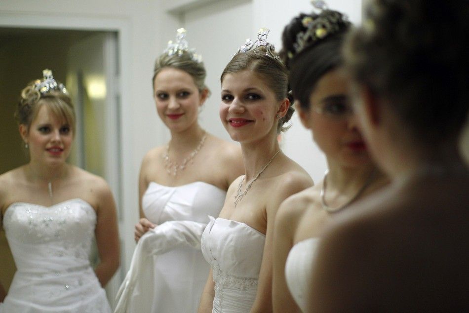 Dancers from the Young Ladies Committee get ready prior to the opening ceremony at the traditional Opera Ball in Vienna