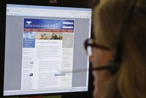 A journalist checks the U.S. Senate's website after it was attacked in 2011.