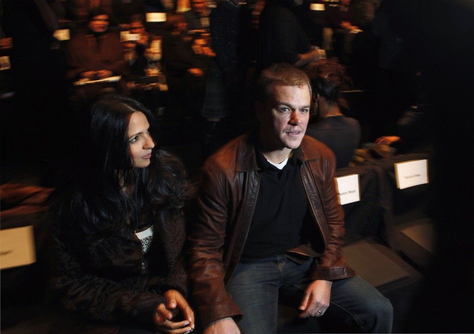 Actor Matt Damon and his wife Luciana Barroso wait for a presentation of the Naeem Khan FallWinter 2012 collection during New York Fashion Week, February 14, 2012.
