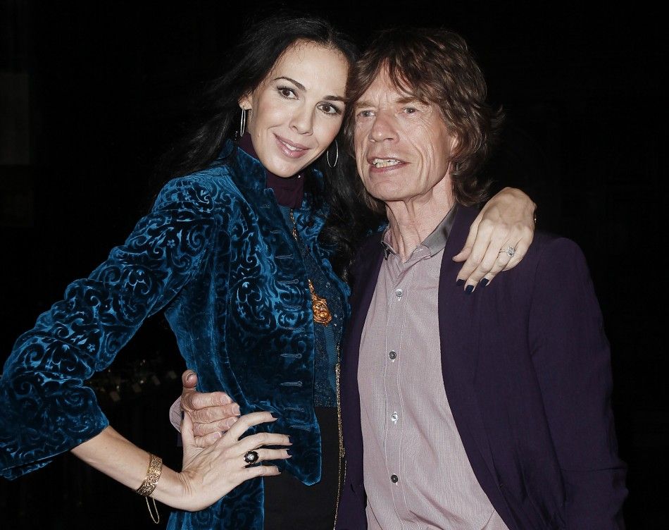 Musician Mick Jagger and designer LWren Scott pose following her FallWinter 2012 collection during New York Fashion Week, February 16, 2012. 