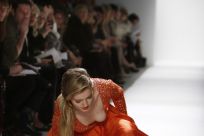 A model falls while presenting a creation at the Dennis Basso Fall/Winter 2012 collection show during New York Fashion Week February 14, 2012