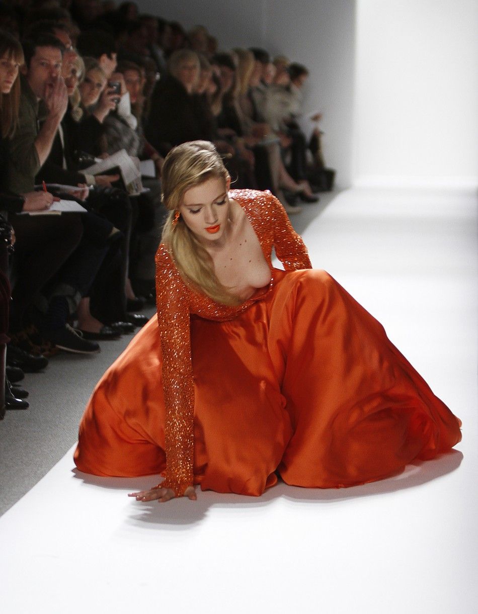 A model falls while presenting a creation at the Dennis Basso FallWinter 2012 collection show during New York Fashion Week February 14, 2012