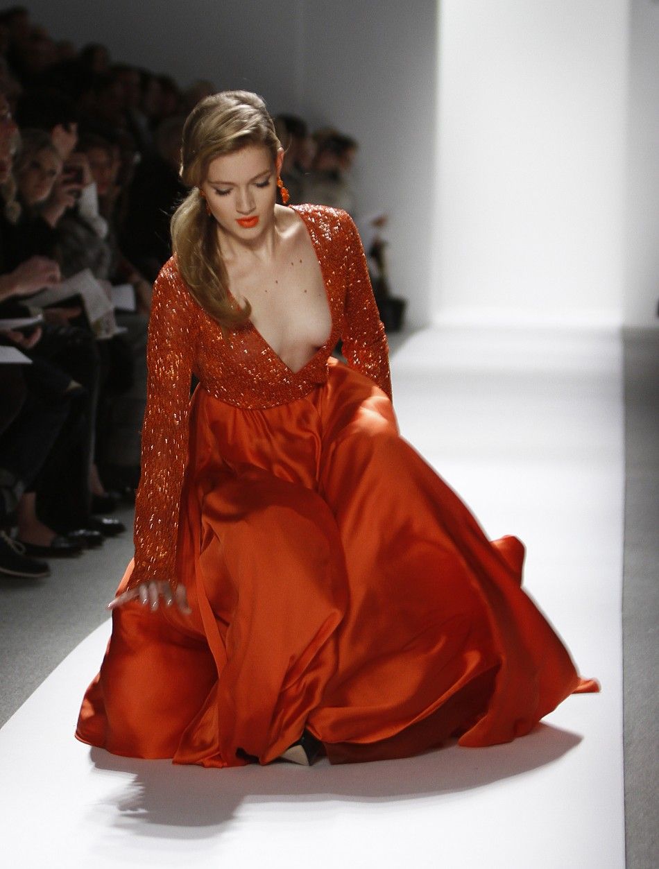 A model falls while presenting a creation at the Dennis Basso FallWinter 2012 collection show during New York Fashion Week February 14, 2012