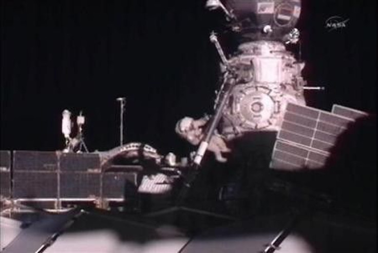 Expedition 30 Russian Flight Engineer Oleg Kononenko works during his spacewalk outside the International Space Station in this image from NASA TV, February 16, 2012.