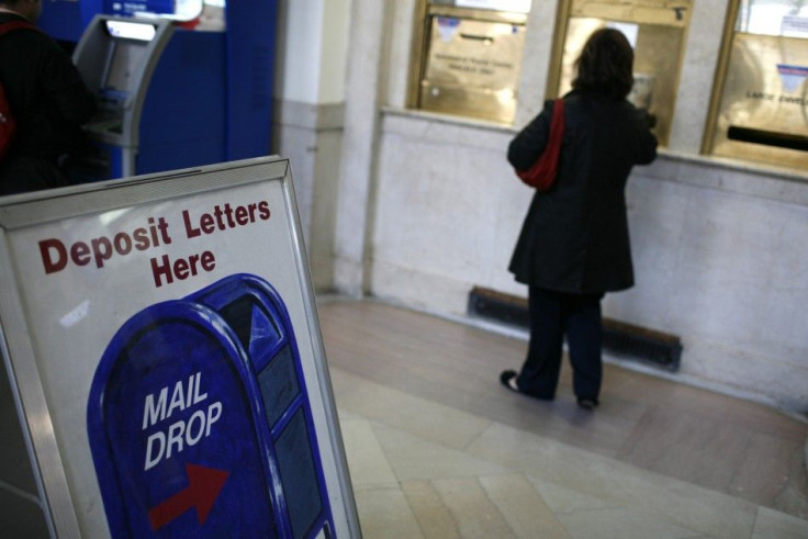 A woman mails envelopes at the James A Farley Post U.S. office in New York.