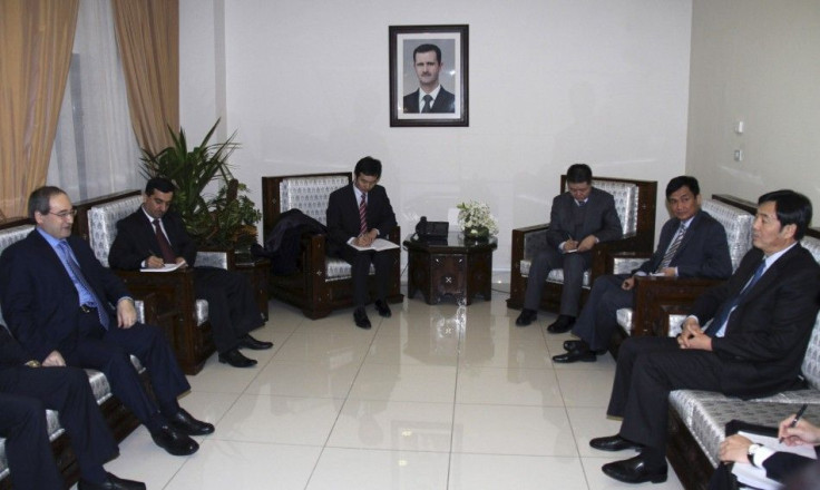 Syrian Deputy Foreign Minister Faisal Mekdad (first L) meets Chinese Vice Foreign Minister Zhai Jun (first R) and other senior diplomats, in Damascus February 17, 2012.