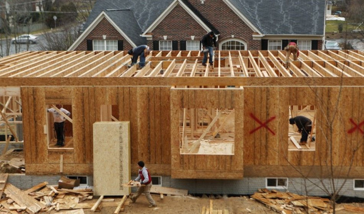 Workers build a new house in Alexandria, Virginia February 16, 2012.
