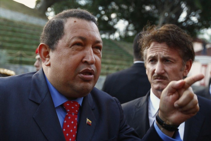 Venezuelan President Hugo Chavez talks to the media as he welcomes U.S. actor Sean Penn at Miraflores Palace in Caracas February 16, 2012.