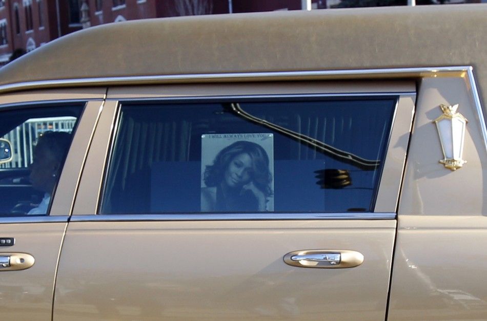 Picture of Houston is seen on window of the hearse carrying late singer to the New Hope Baptist Church for her funeral service in Newark