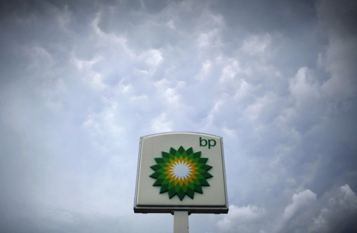 Storm clouds form near a BP station in Alexandria, Virginia July 19, 2010.