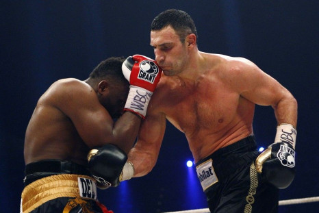 WBC heavyweight boxing champion Vitali Klitschko, right, lands a punch on challenger Dereck Chisora during their title bout in Munich February 18, 2012. Klitschko won the fight after 12 rounds by a 3-0 judge decision.