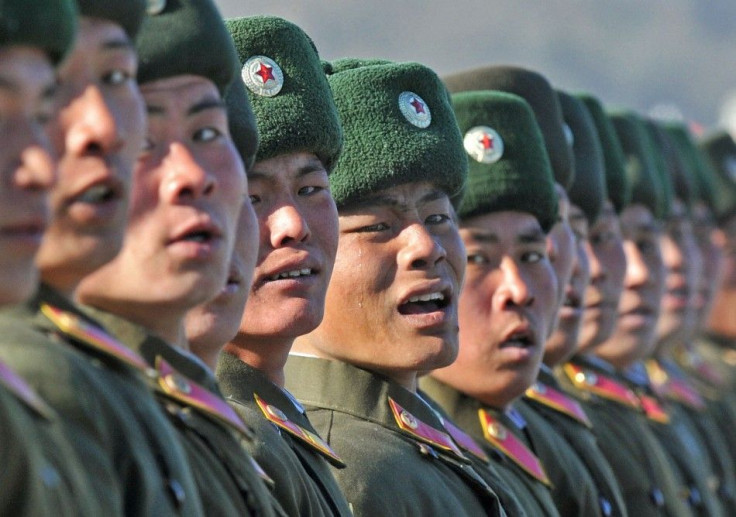 A North Korean soldier cries as he marches during a military parade to mark the birth anniversary of the North's late leader Kim Jong-Il in Pyongyang, in this photo taken by Kyodo, February 16, 2012.