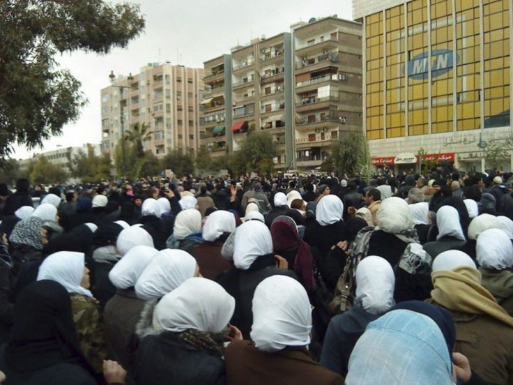 Anti-government protesters attend the funerals of protesters killed during clashes with government troops in earlier protests against Syria&#039;s President Bashar al-Assad, in Damascus February 18, 2012.