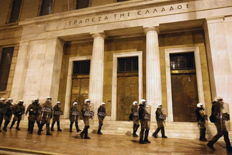 Riot policemen protect building of Bank of Greece during an anti-austerity protest in central Athens