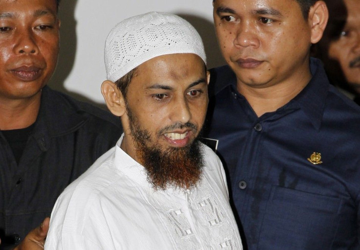 Umar Patek, a suspected bomb-maker for Jemaah Islamiah, arrives at a courtroom in Jakarta a