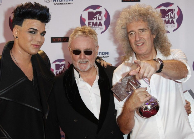 Adam Lambert poses after performing with Roger Taylor and Brian May of Queen at the MTV Europe Music Awards