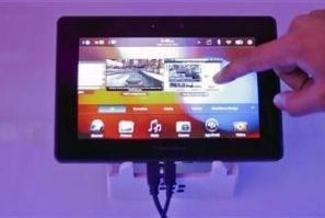 A conference attendee examines the BlackBerry PlayBook during its launch in Mumbai June 22, 2011.
