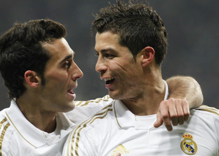 Real Madrid&#039;s Ronaldo celebrates after scoring against CSKA Moscow with team mate Arbeloa during their Champions League last 16 first leg soccer match at the Luzhniki stadium in Moscow
