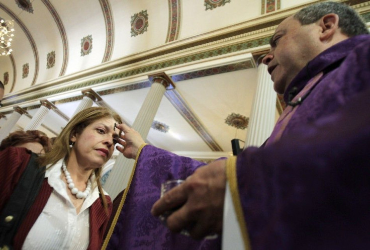 A woman receives ashes during the traditional Ash Wednesday service, at the Metropolitan Cathedral in San Jose.