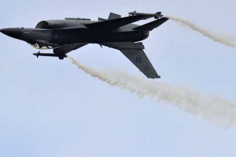 A General Dynamics F-16 Fighting Falcon fighter jet performs during an air display at the Farnborough Airshow 