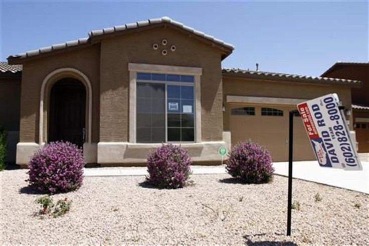 A real estate for sale sign is displayed outside a home in Chandler Heights, Arizona