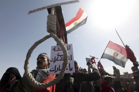 Relatives of victims killed during the revolution demonstrate outside the court house calling for Mubarak&#039;s execution
