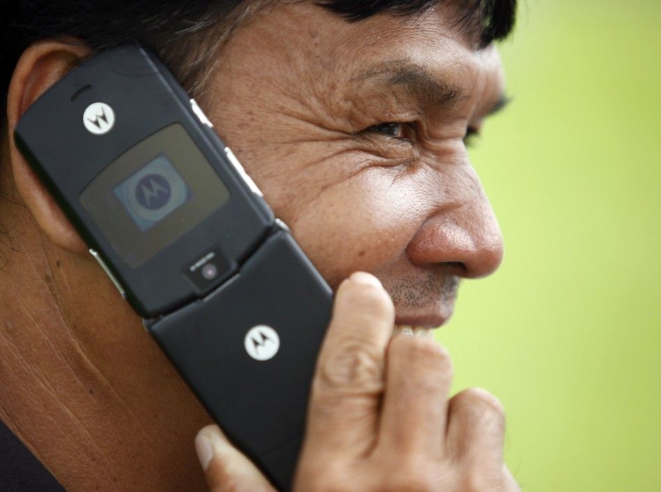 A man uses his Motorola mobile phone in Bangkok