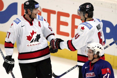 Will this become a familiar sight? Rick Nash and Joe Thornton celebrate a goal for team Canada.