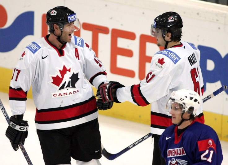 Will this become a familiar sight? Rick Nash and Joe Thornton celebrate a goal for team Canada.