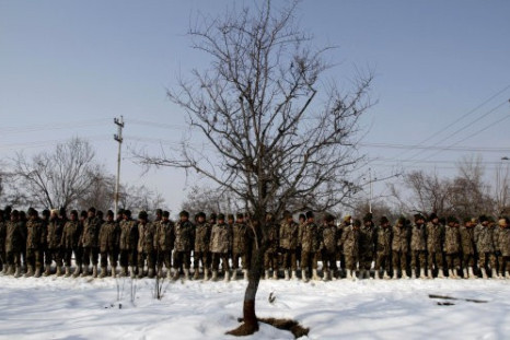 India Border Security Force (BSF) soldiers lined up during a wreath laying ceremony of their colleague, who died after being buried under an avalanche debris, inside their base camp on the outskirts of Srinagar, India, Thursday, Jan 25, 2012. Photo: PA