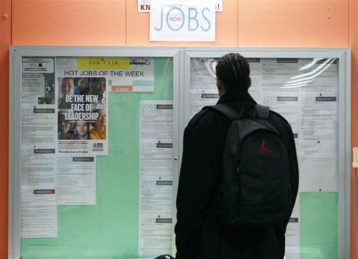 File photo of a man looking at employment opportunities at a jobs center in San Francisco