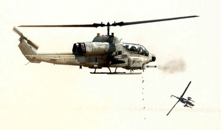 MARINE SUPER COBRA HELICOPTERS FIRE AT TARGETS.