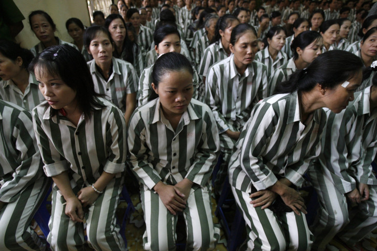 Inmates wait before they are released from Thanh Xuan prison outside Hanoi